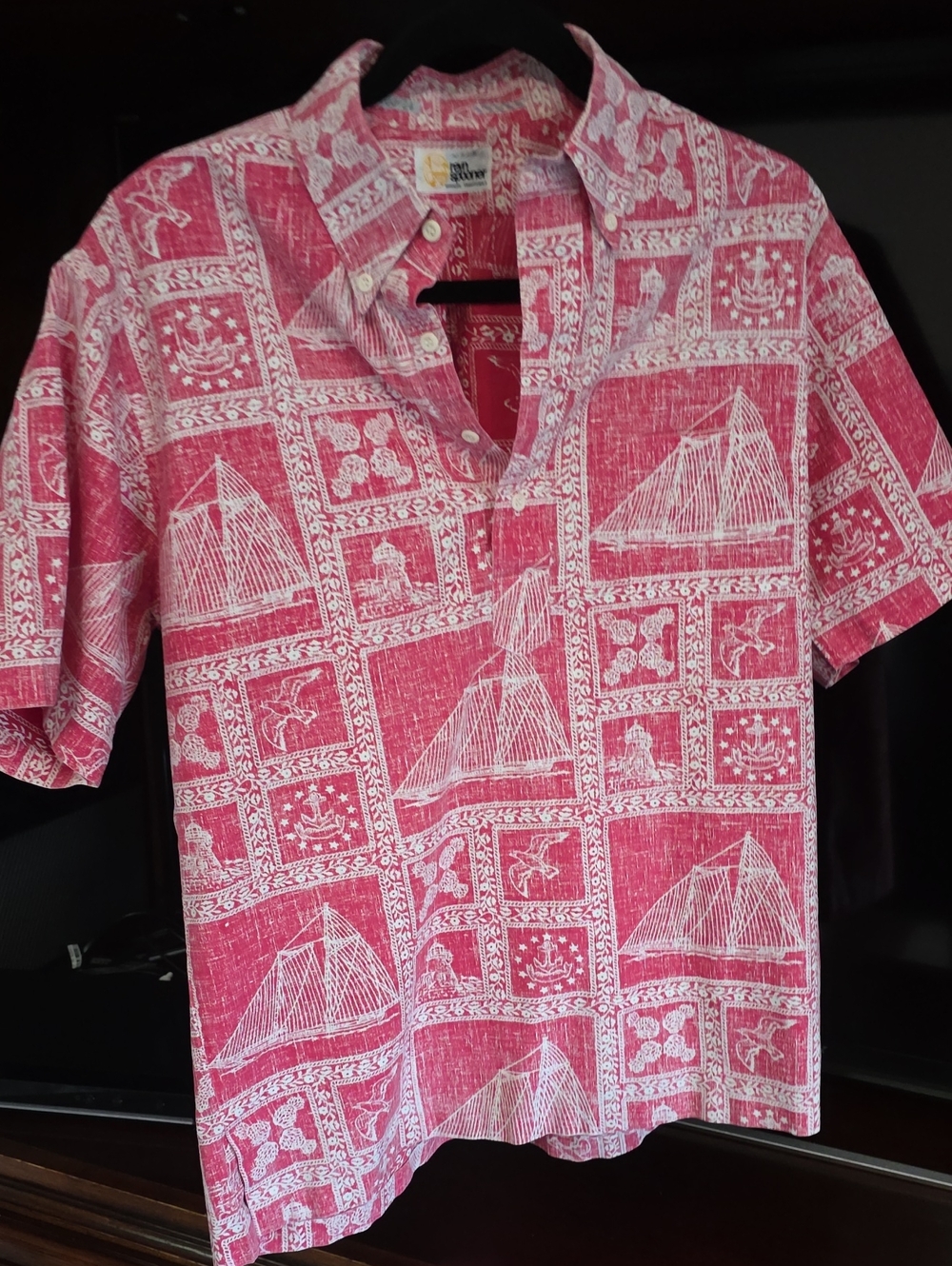 Reyn Spooner Hawaiian shirt features a vibrant red and white reverse nautical pr